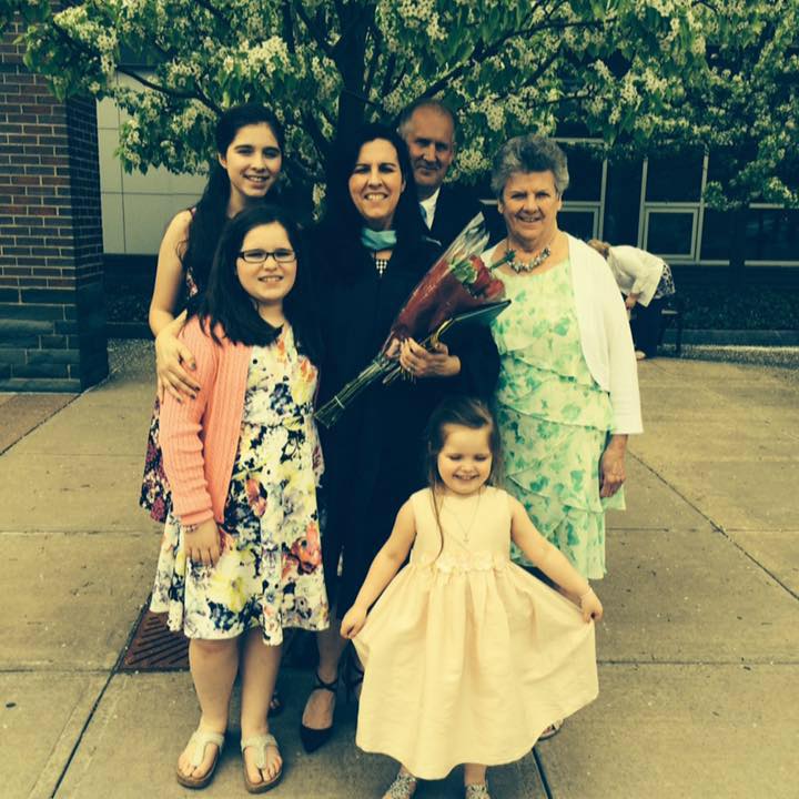 This is a photo of Principal Dawn Kivlehan, center, pictured with her family surrounding her.