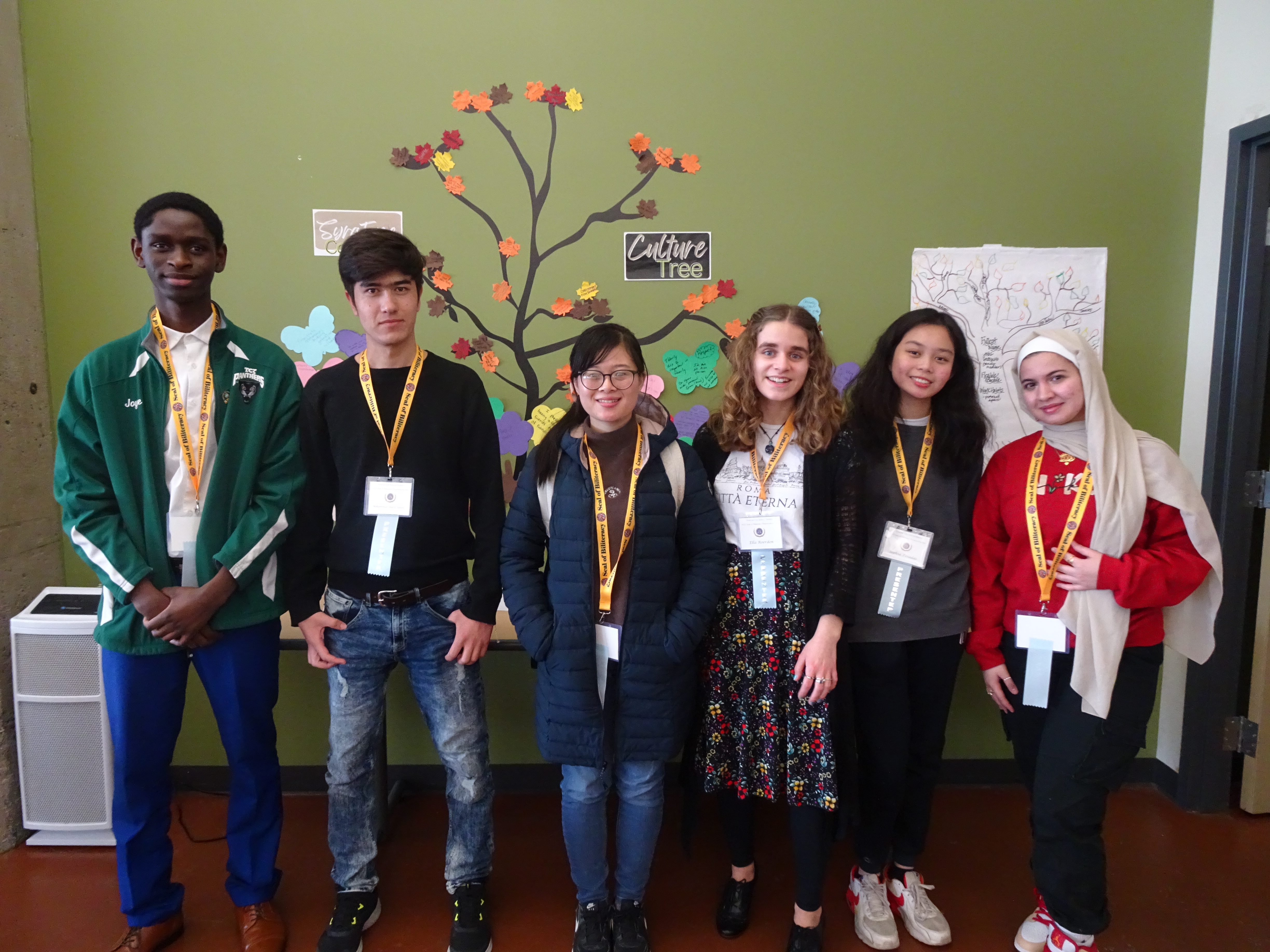 This is a photo of six SCSD students standing in a line, smiling at the camera.