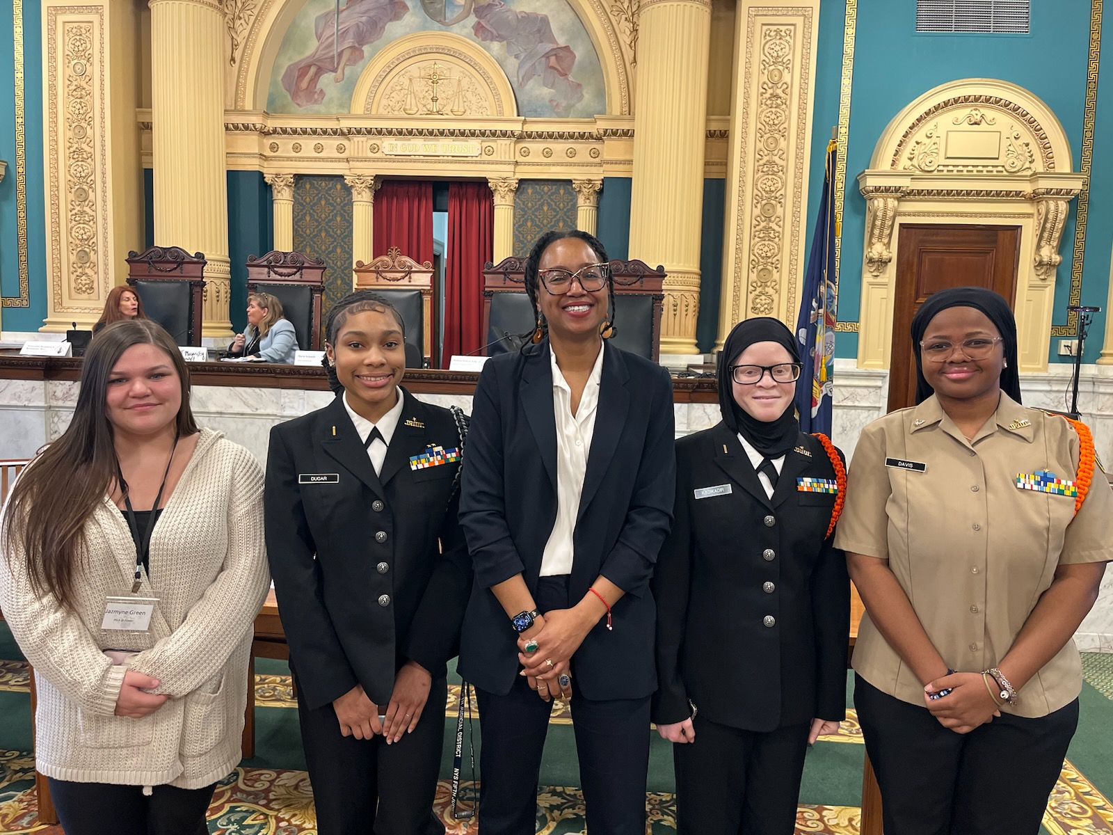 This is a photo of four PSLA at Fowler students standing alongside a Syracuse City Court Judge in the Onondaga County Courthouse.