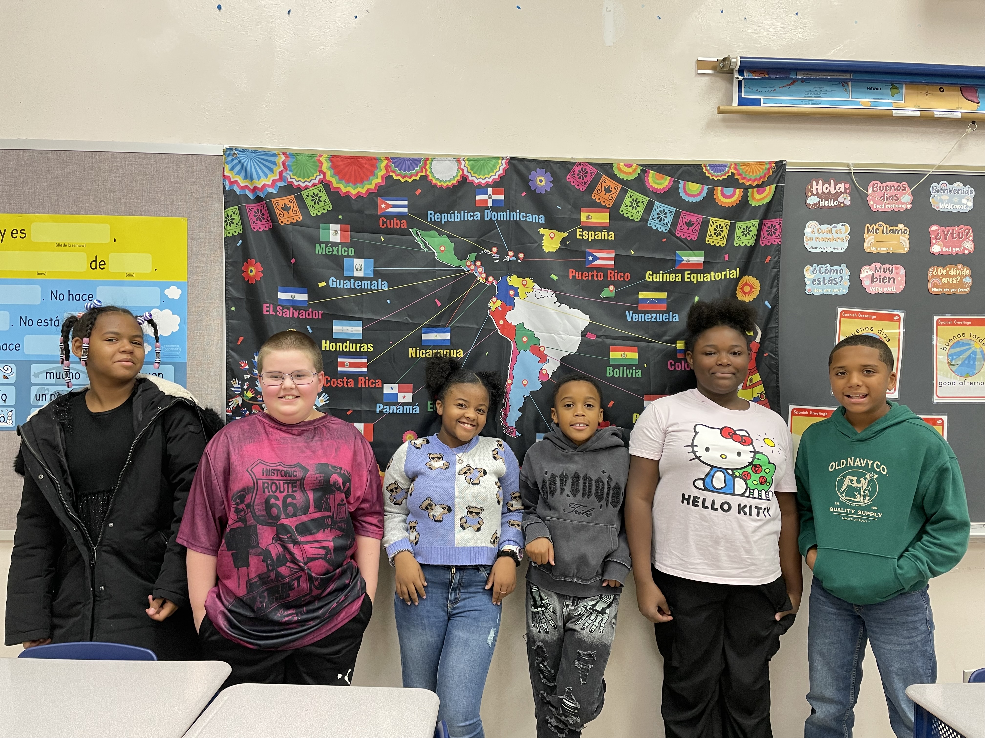 This is a photo of a group of Van Duyn students standing in their Spanish classroom.