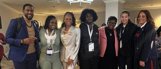 This is a photo of SCSD students with Board President Barnett and political representatives in Albany.