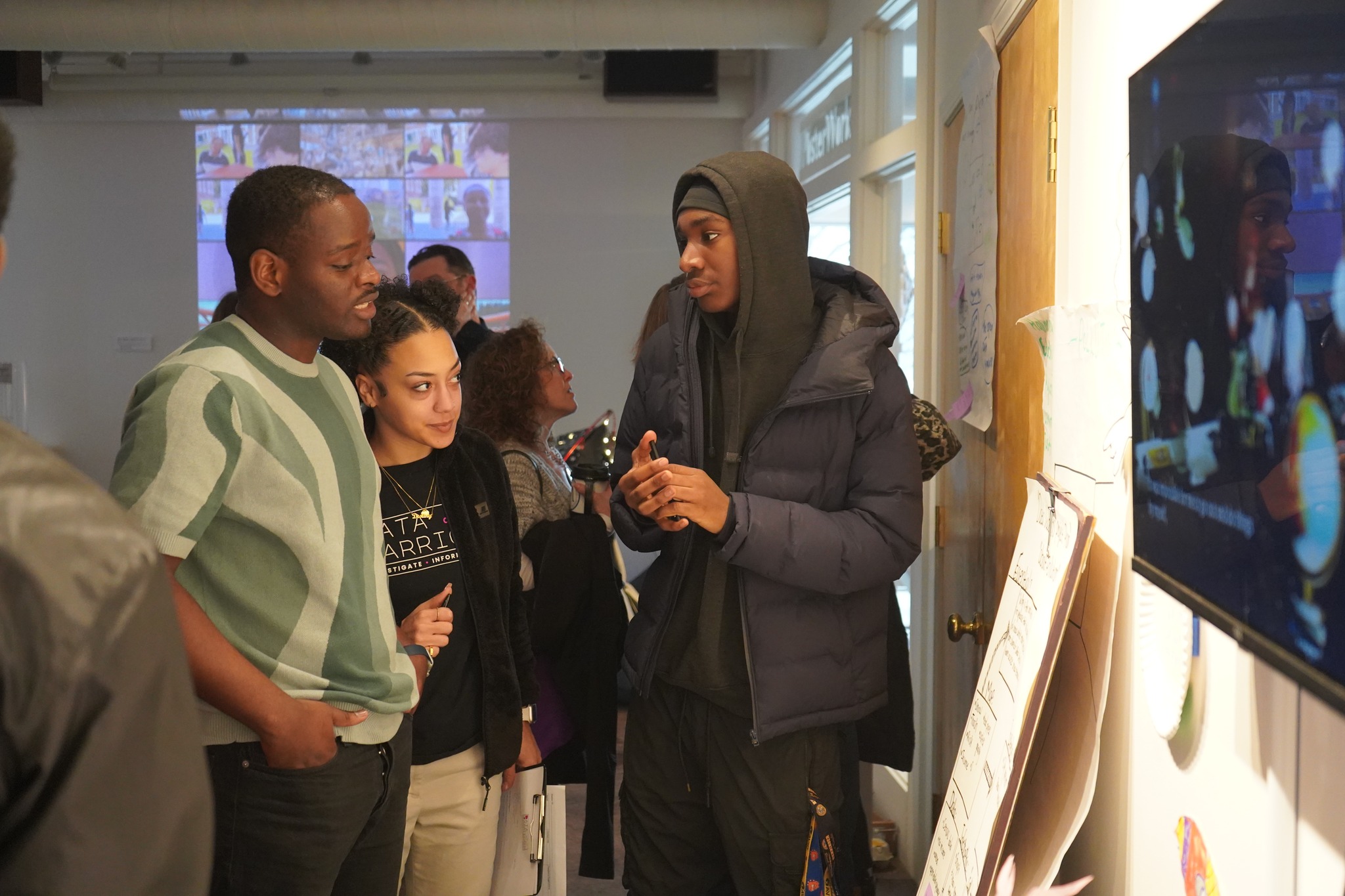 This is a photo of a student presenting at a Data Warriors event.