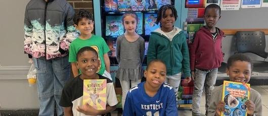 Turning Pages with Tokens: Book Vending Machine Inspires Love of Literacy at STEAM at Dr. King